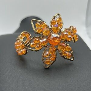 Adjustable cuff style wired flower bracelet iridescent yellow/orange beads